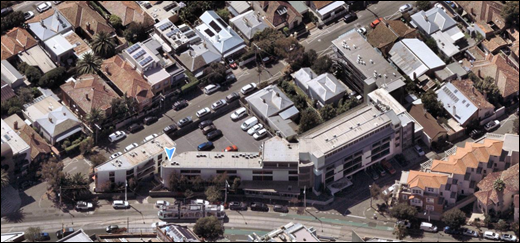 Aerial view of a city with cars and buildings

AI-generated content may be incorrect.