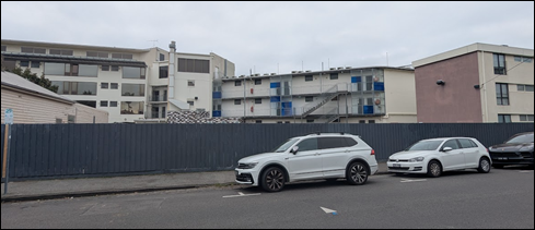 A white car parked in front of a fence

AI-generated content may be incorrect.