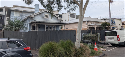 A house with a fence and a tree

AI-generated content may be incorrect.
