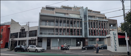 A building with a motorcycle parked on the corner of the street

AI-generated content may be incorrect.