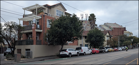 A row of cars parked on the side of a road

AI-generated content may be incorrect.